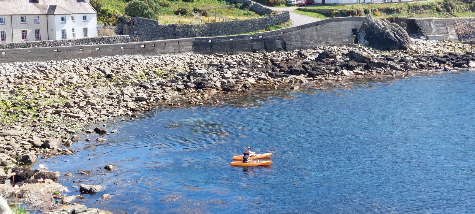 The harbour below the centre with a kayak on the water