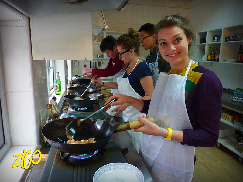 A participant at the wok during the cooking class