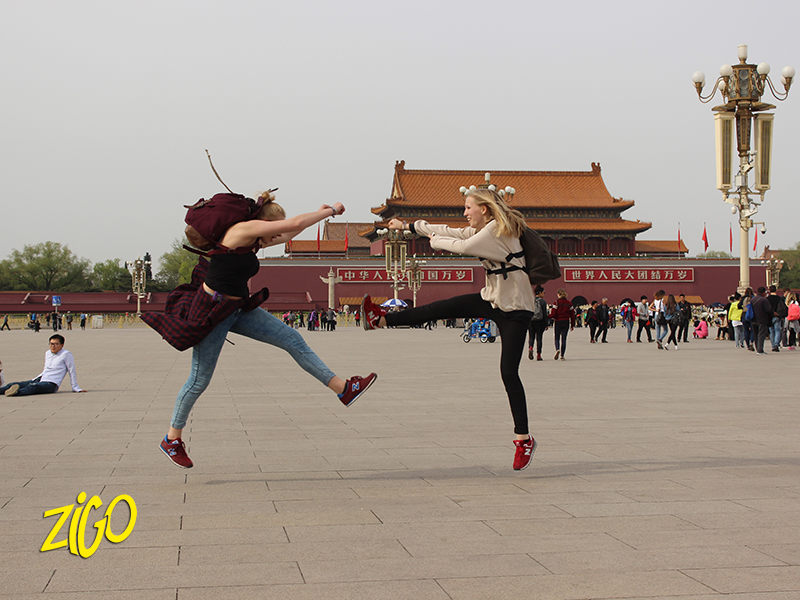 Participants jumping in front of a city gate