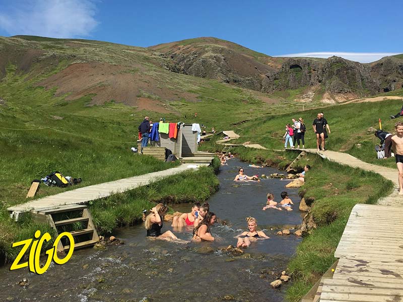 Bathing in the warm river of the Reykjadalur valley