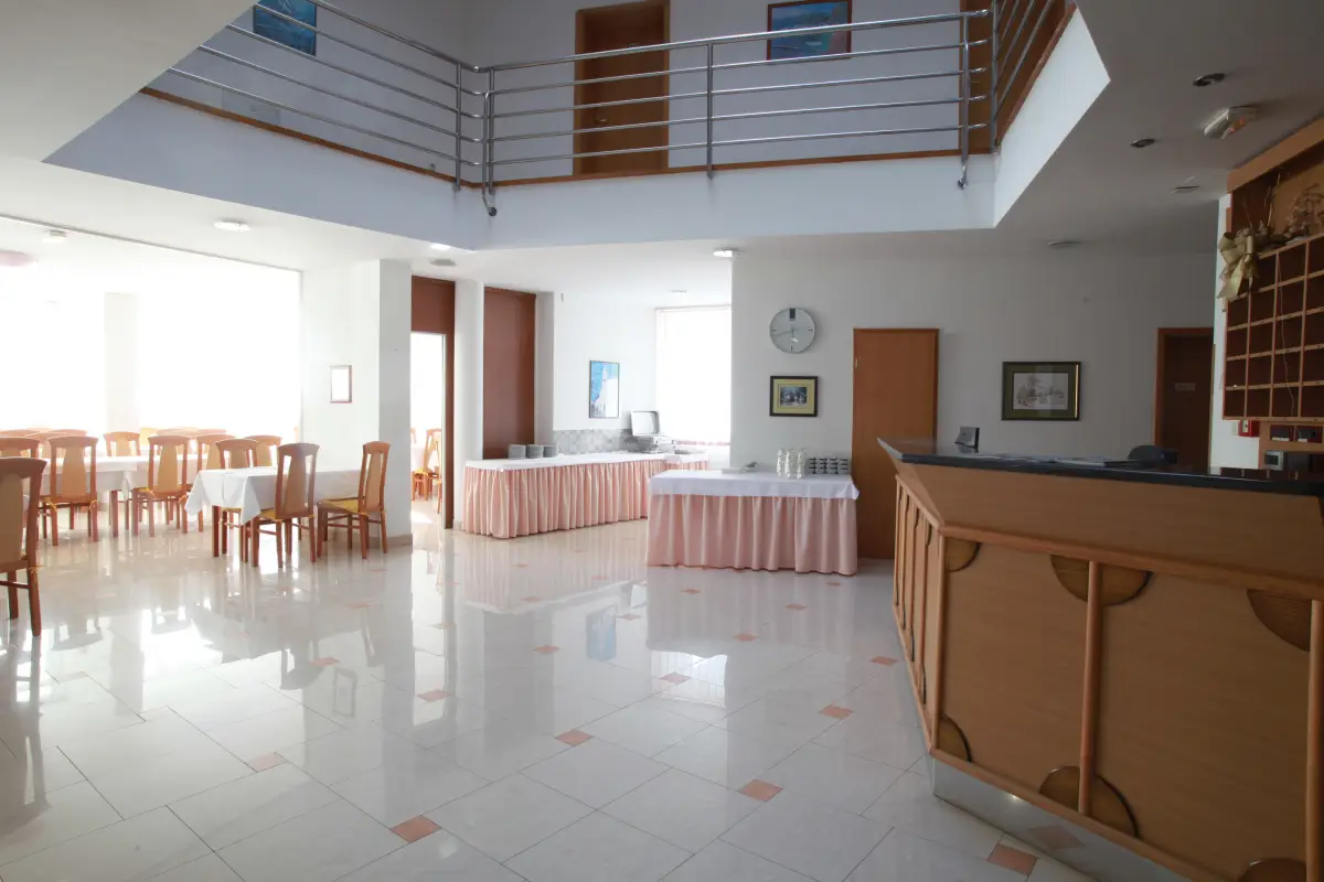 Hotel dining room with laid tables where the buffets are served