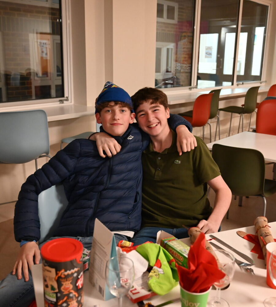 Two boarders side by side at a decorated table in the Luckley House School dining room
