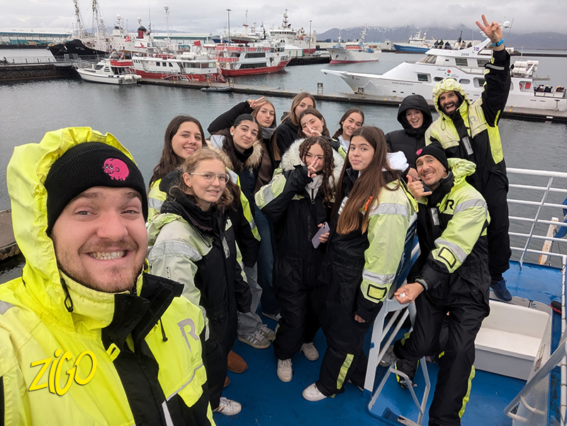 The group on a boat trip in survival suits