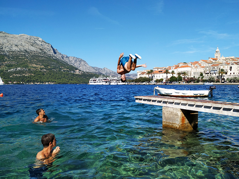 Swimming and diving from a pontoon on the Adriatic