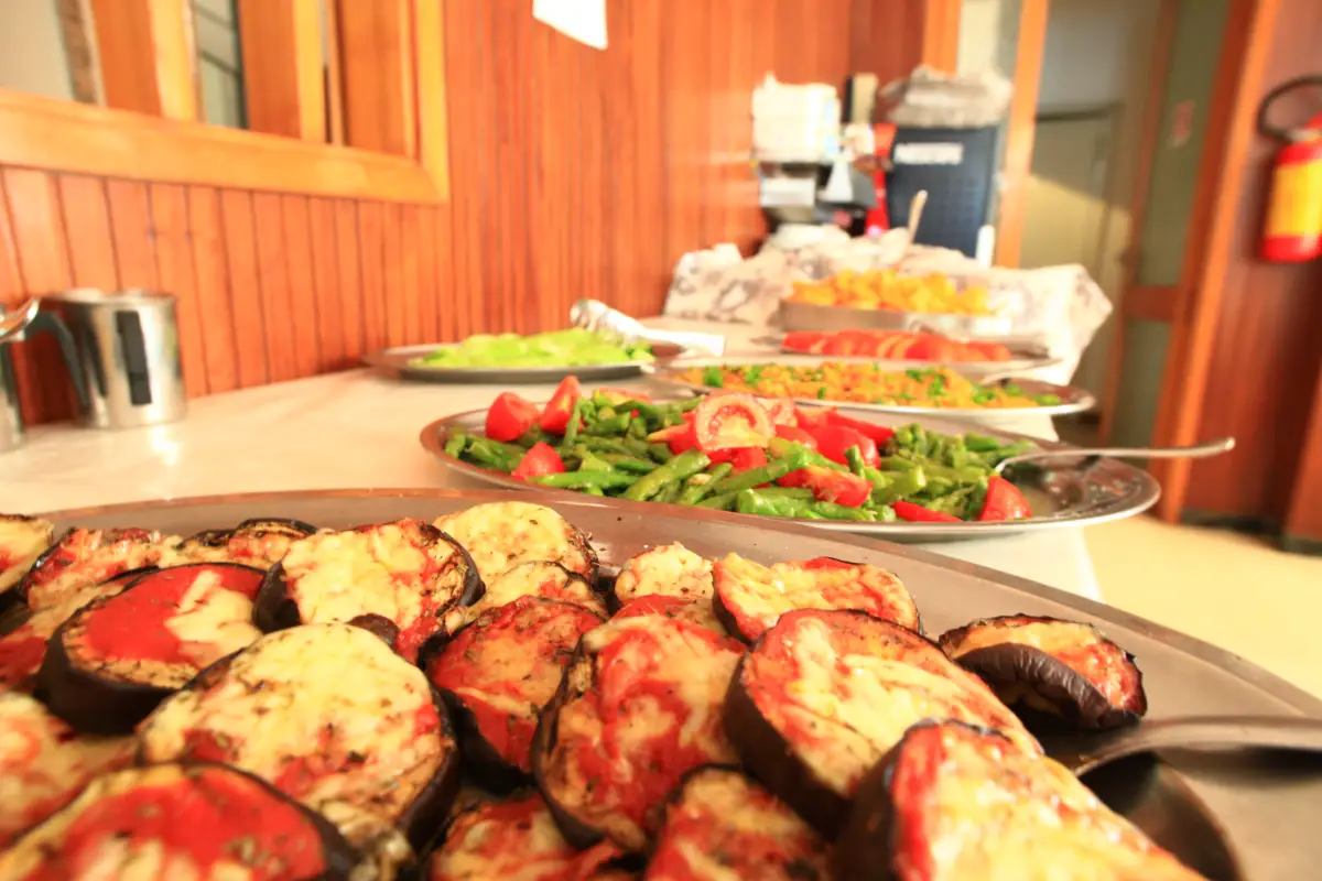 Trays of aubergine parmigiana and mixed salads on the buffet at the Jugendtours hotel in Rimini Miramare