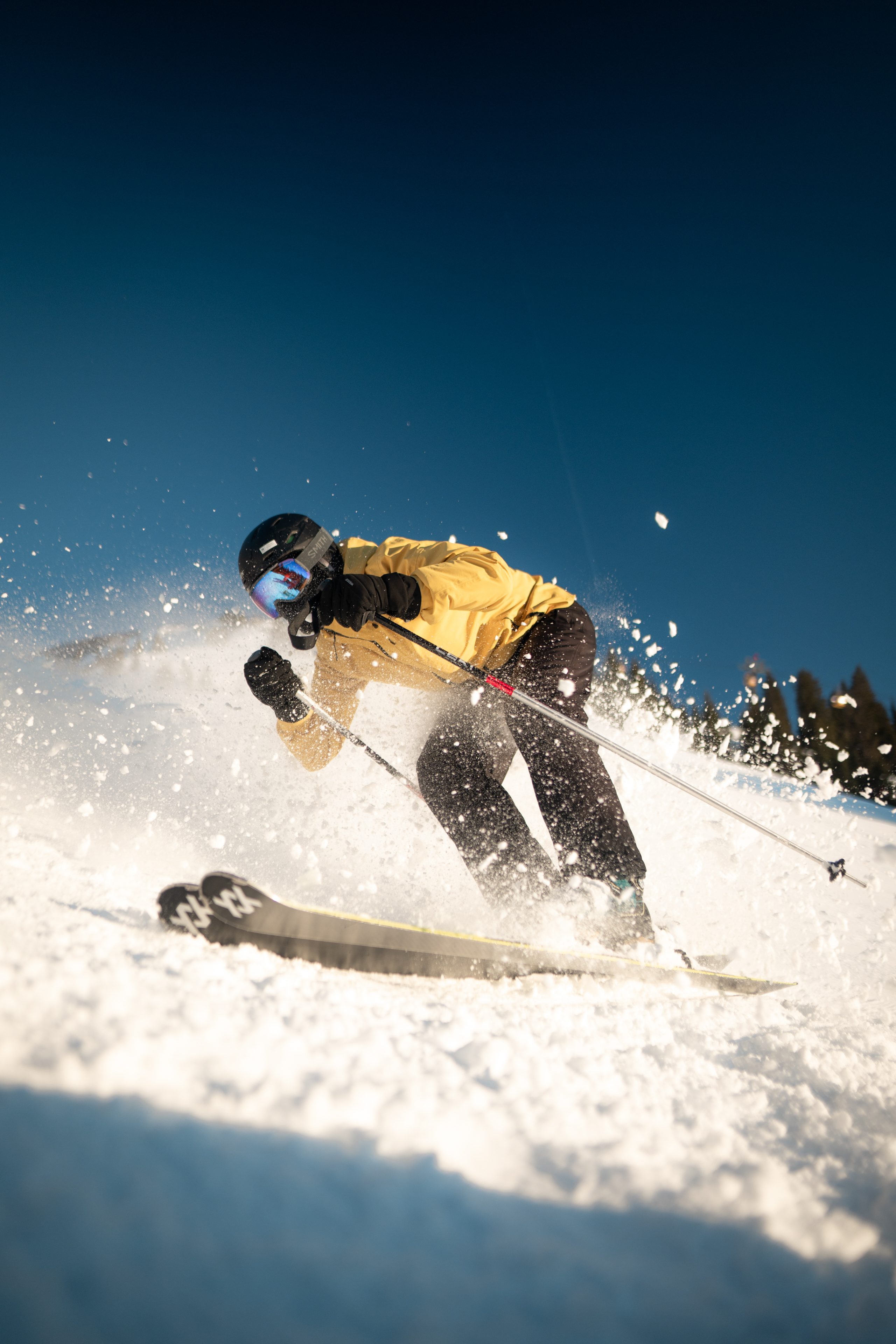 Skier in a yellow jacket