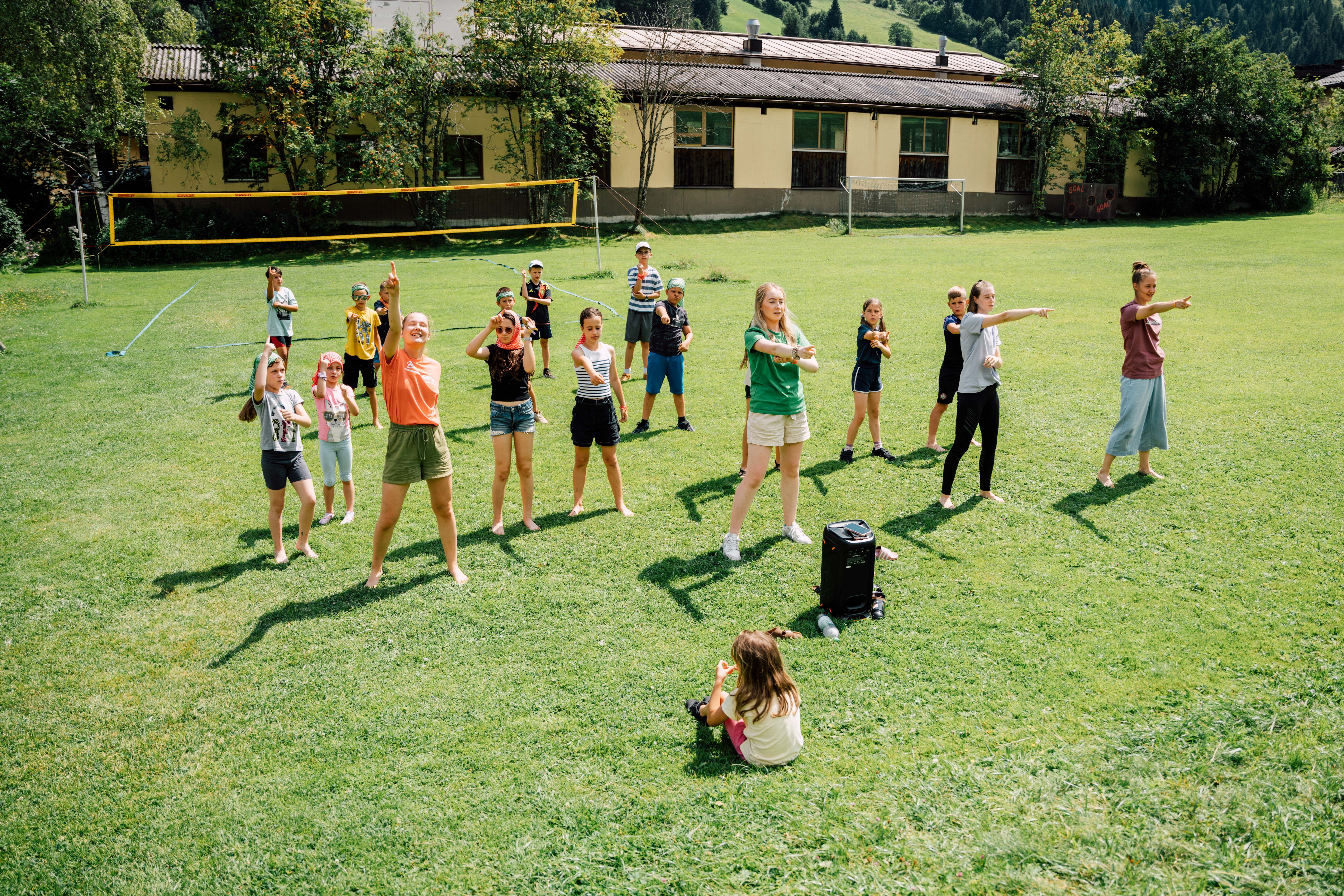 Children dancing in a meadow