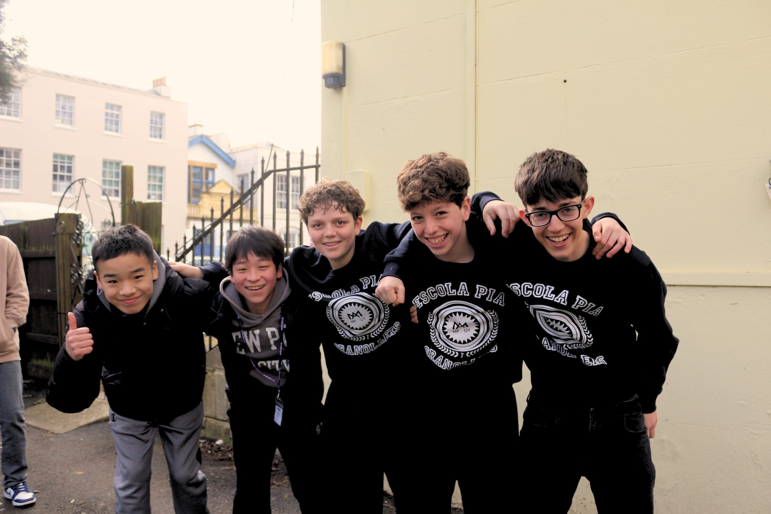 A group of teenage international students smiling together at inlingua Cheltenham