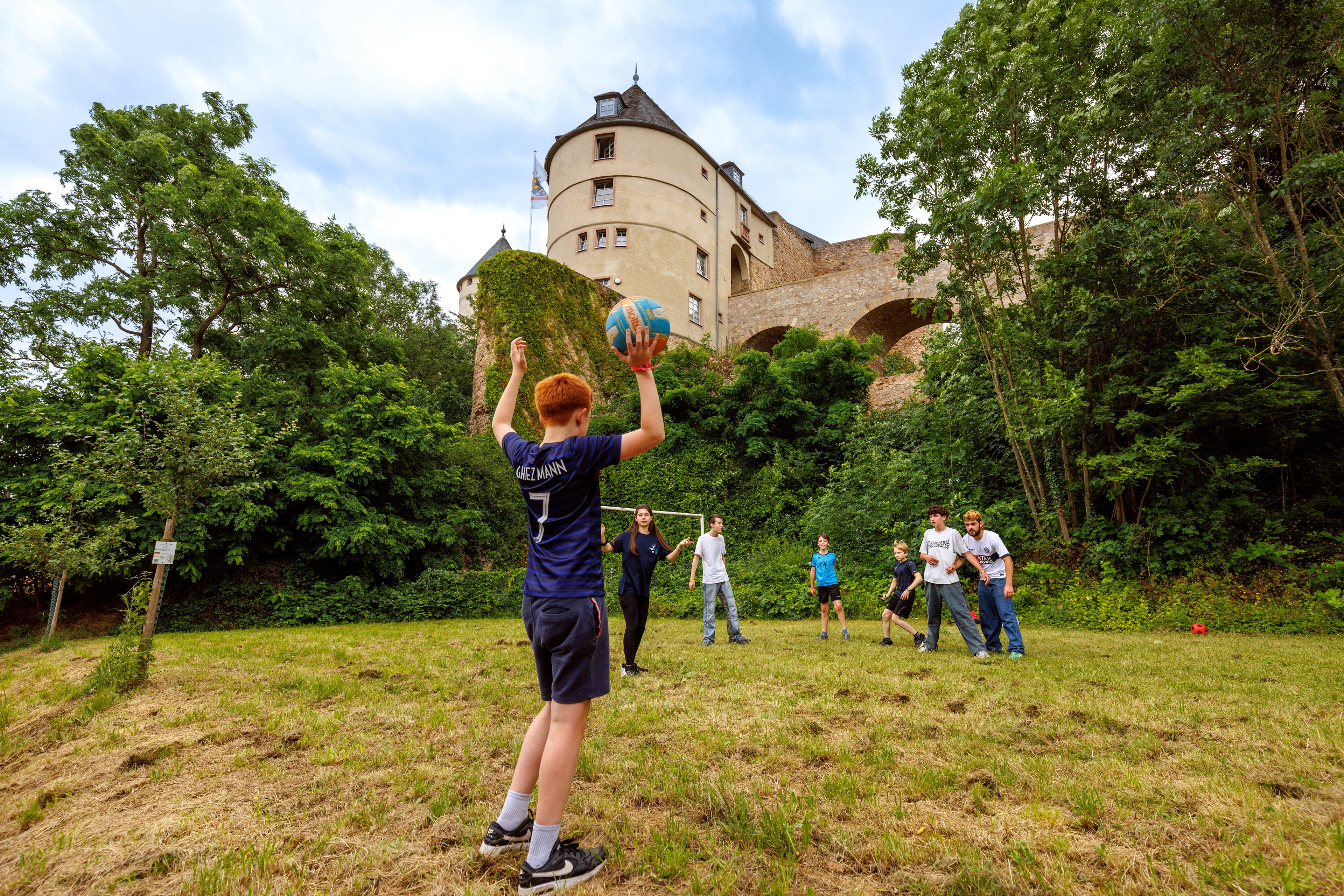 Playing football in the shade of the castle