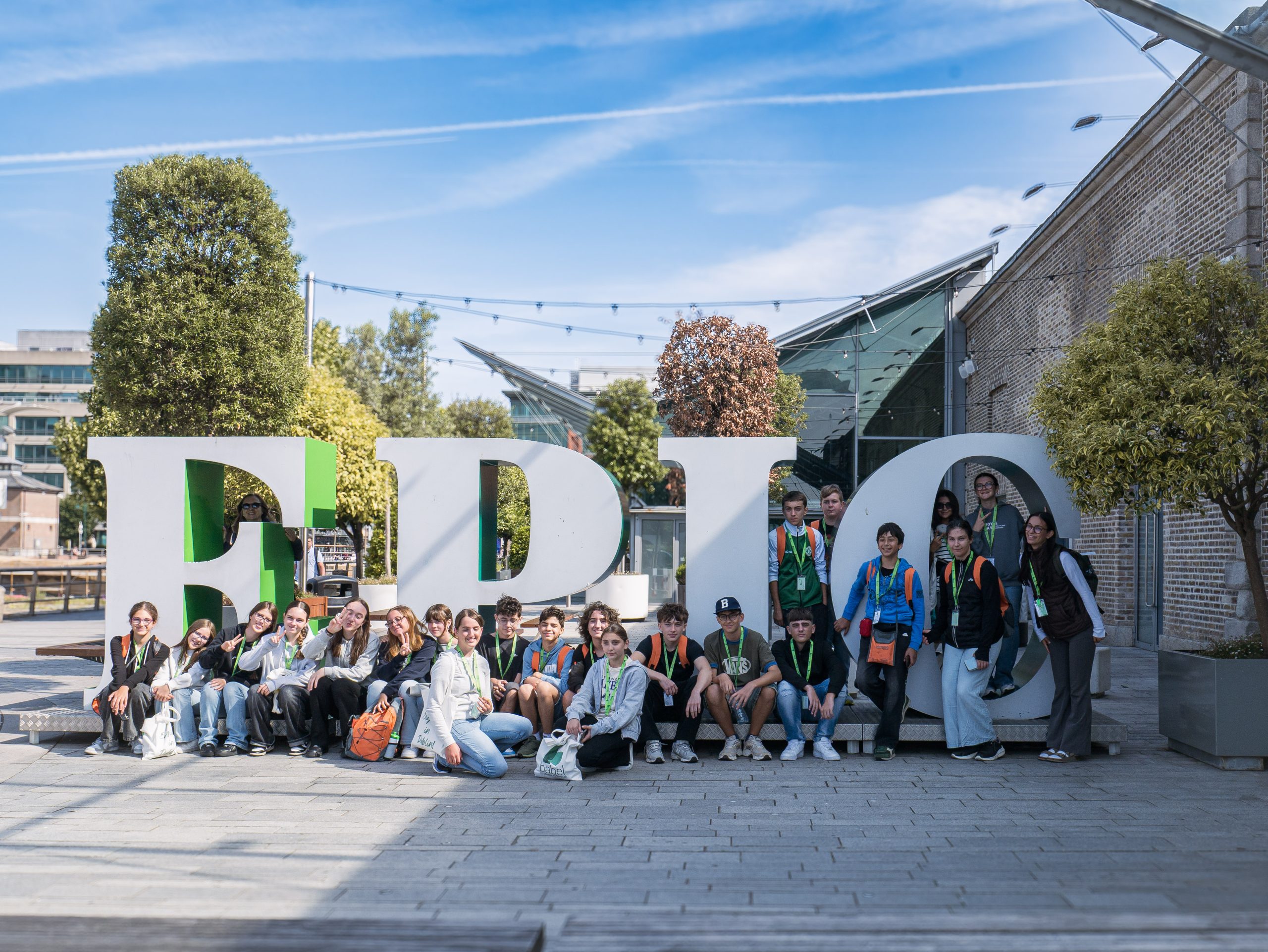 The DCU junior group sitting in front of the large EPIC letters outside the EPIC museum in Dublin