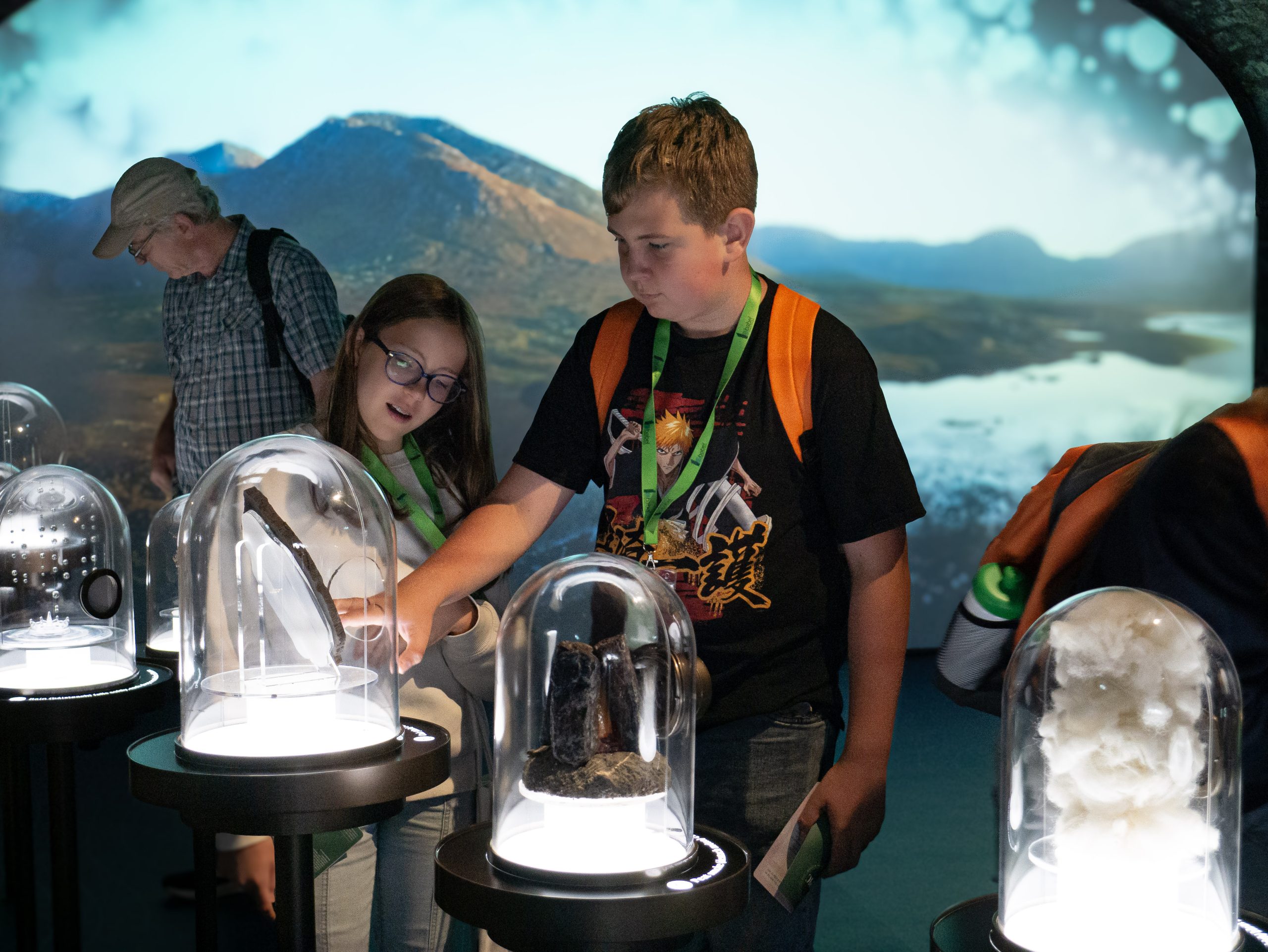 Students looking at exhibits under glass domes inside the EPIC museum during an excursion from DCU