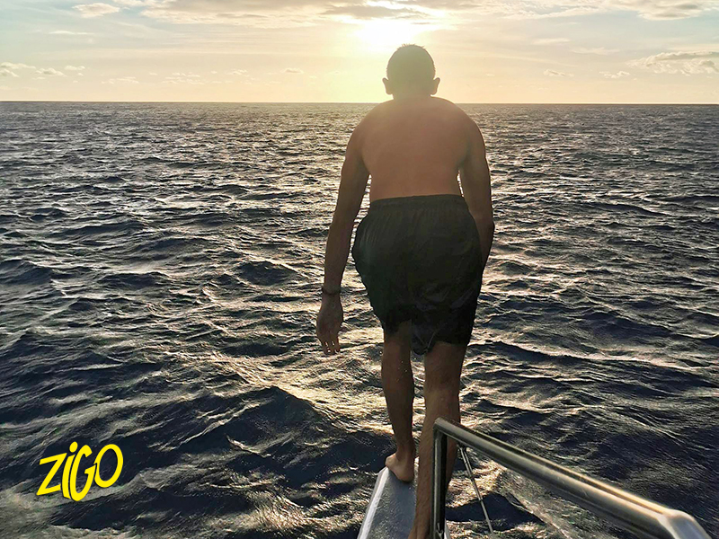 At the water edge on the volcanic rocks at sunset