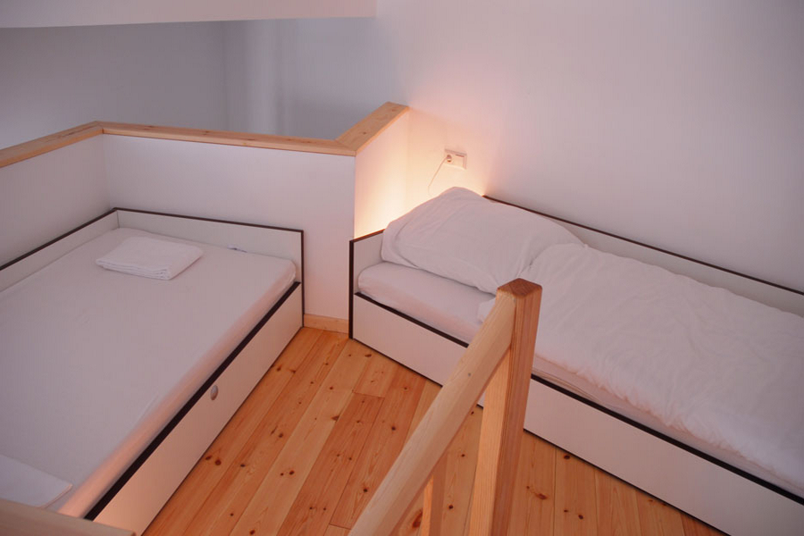 The apartments on campus are mini-lofts, with the sleeping area on a higher upstairs level (3 - 5 beds per apartment)