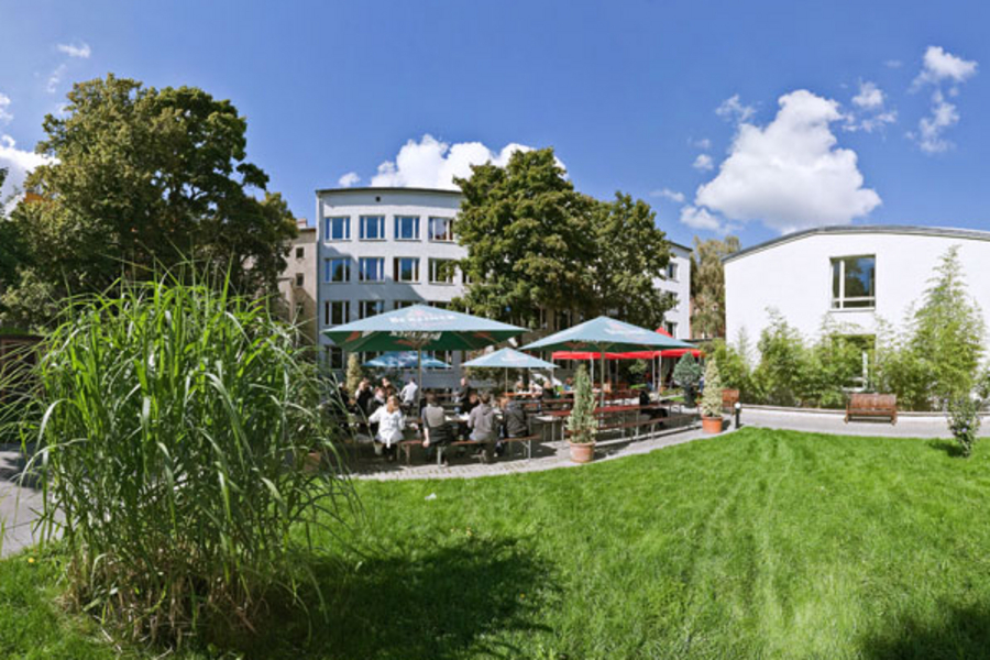 Inside the campus - the cafeteria in the garden and behind it the class rooms (in the white buildings)
