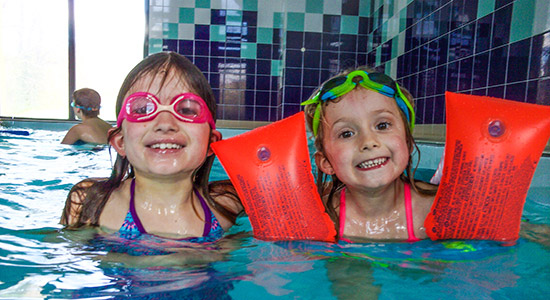Children of the holiday camp in the heated indoor swimming pool of the Manoir du Viginet at Saint-Nectaire