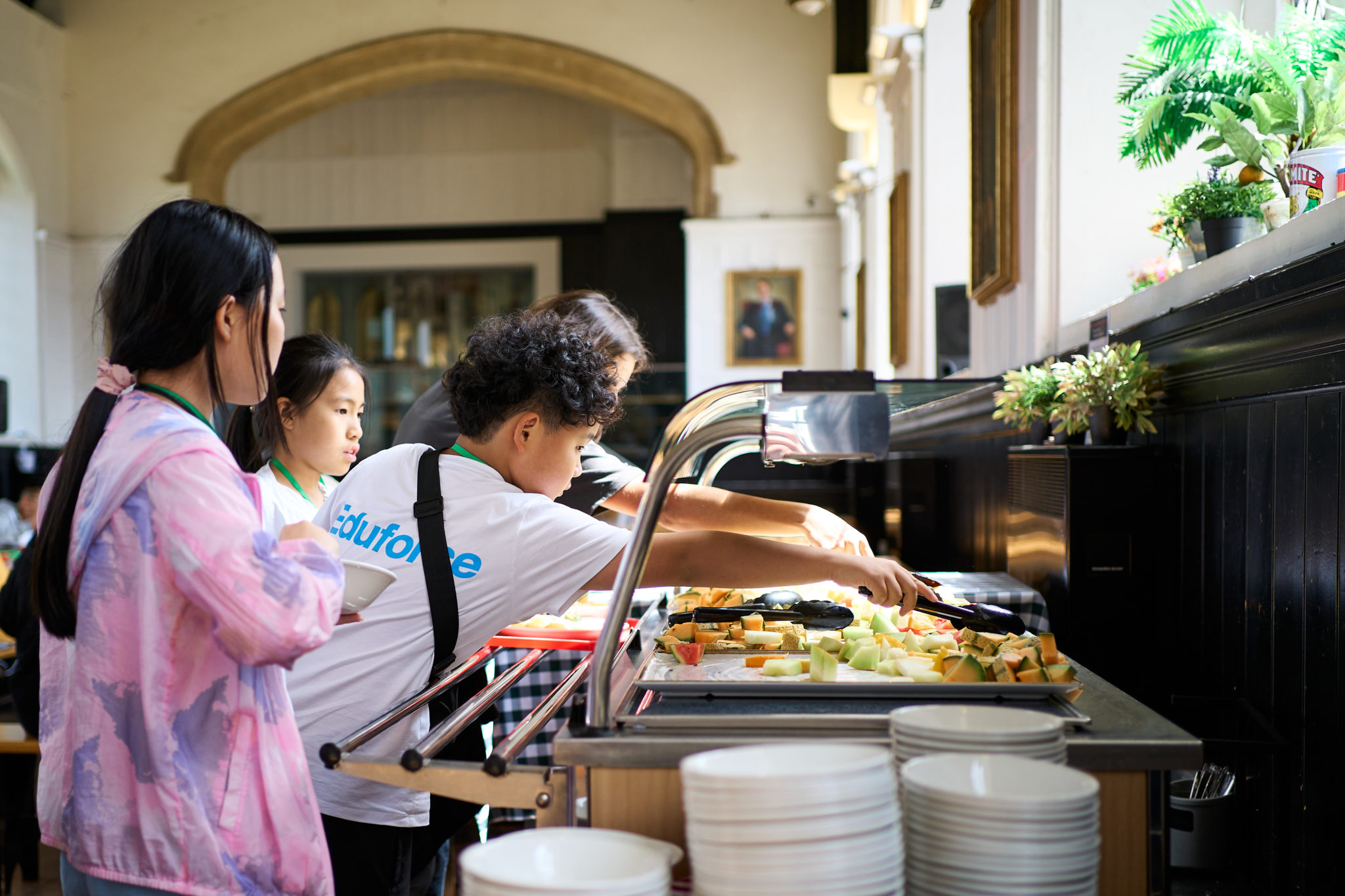 Students serving themselves food at the refectory counter at Hurst College