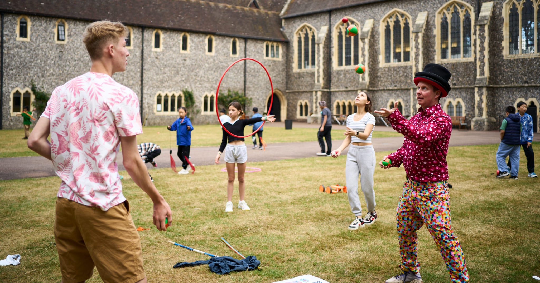 Students and activity leaders playing games on the grass quad at Hurst College