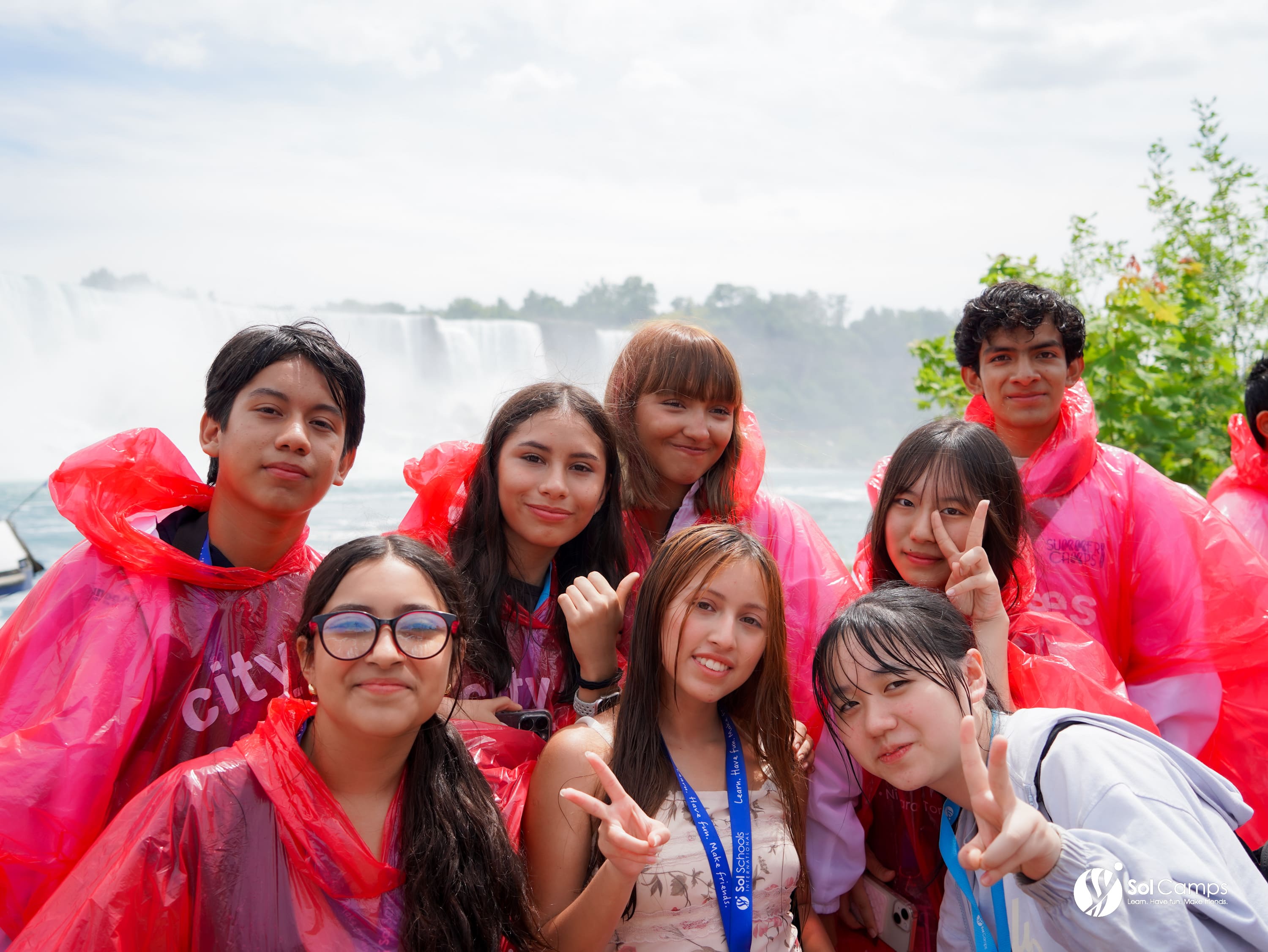 Sol Camps Toronto campers in red rain ponchos at Niagara Falls
