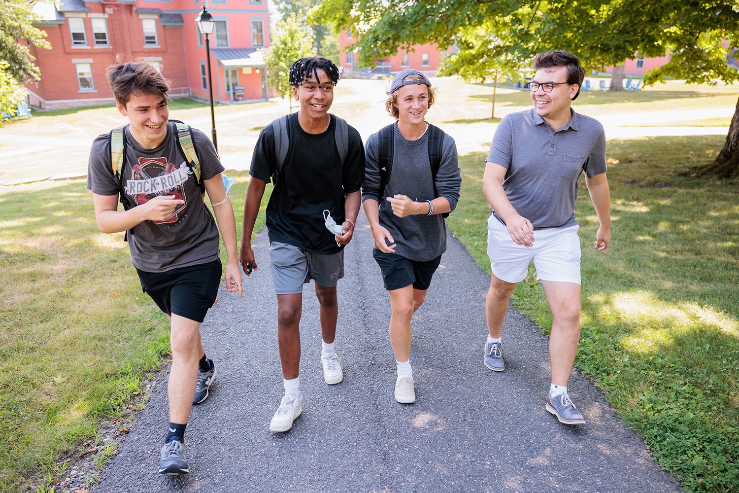 Students walking together along a campus path on their way to lunch