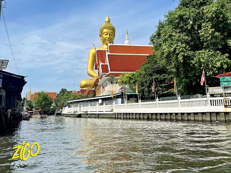 A golden Buddha above the river in Bangkok