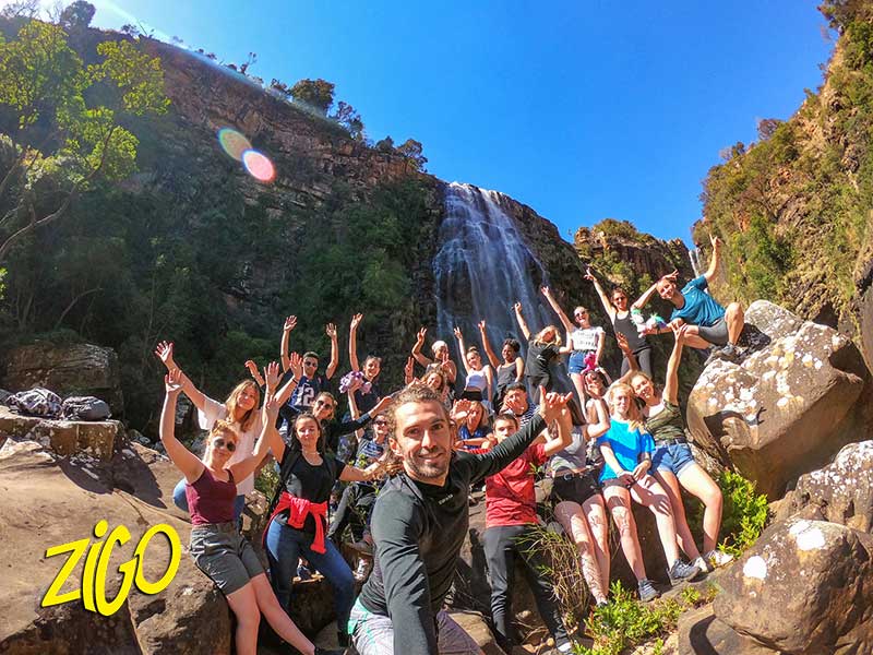 The group at the foot of a waterfall