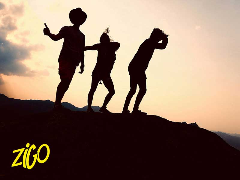 Participants silhouetted against the sunset