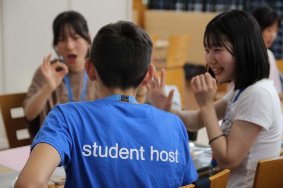 British English Student Hosts sitting with international students at Benenden