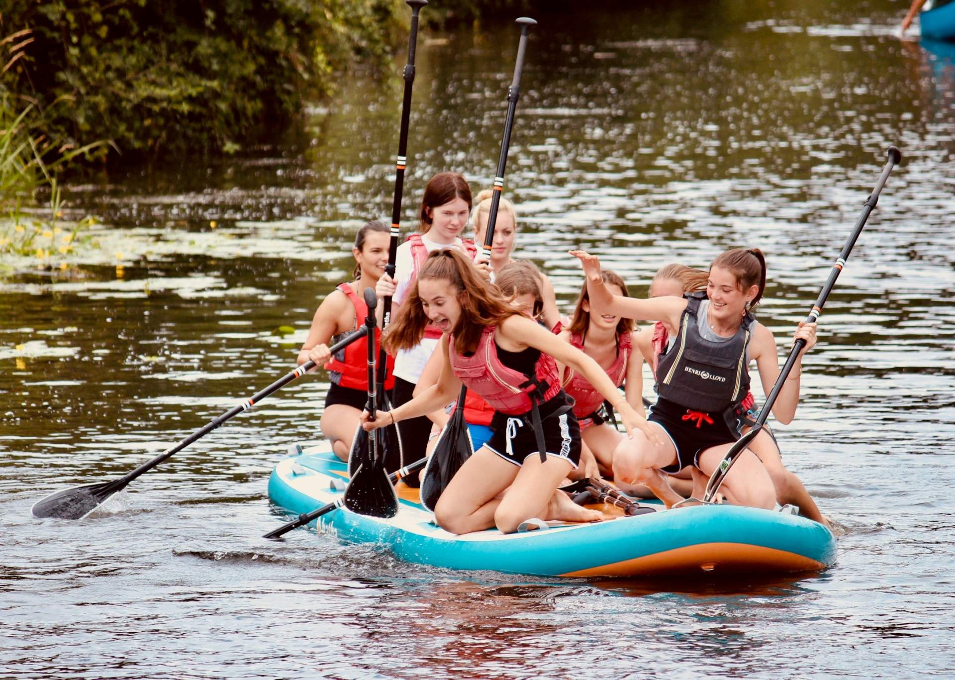 Summer school students canoeing during an activity afternoon