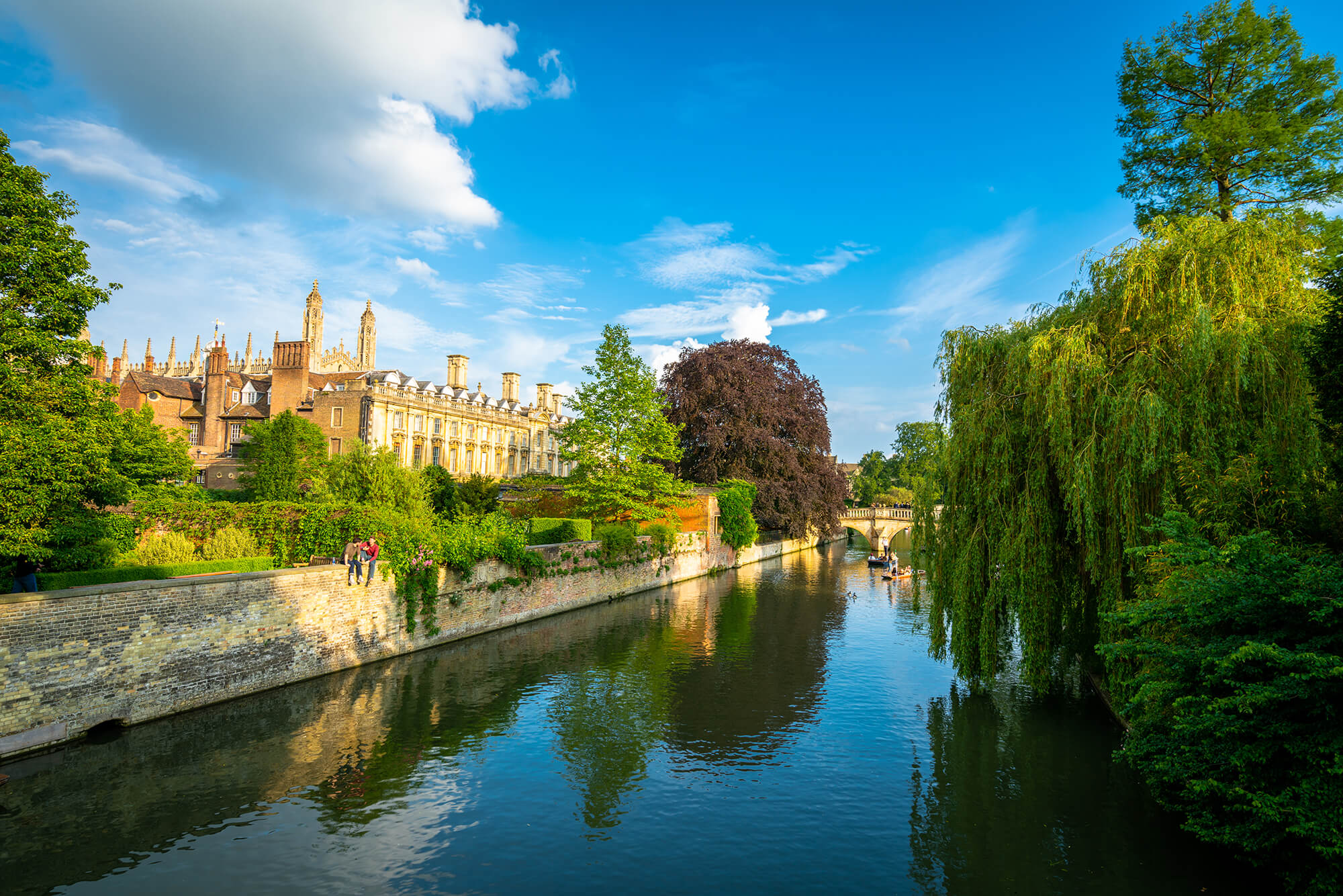 The River Cam running past college buildings and willow trees in Cambridge