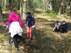 Children out in the woods near Villa Frida scouting and shooting scenes for their film
