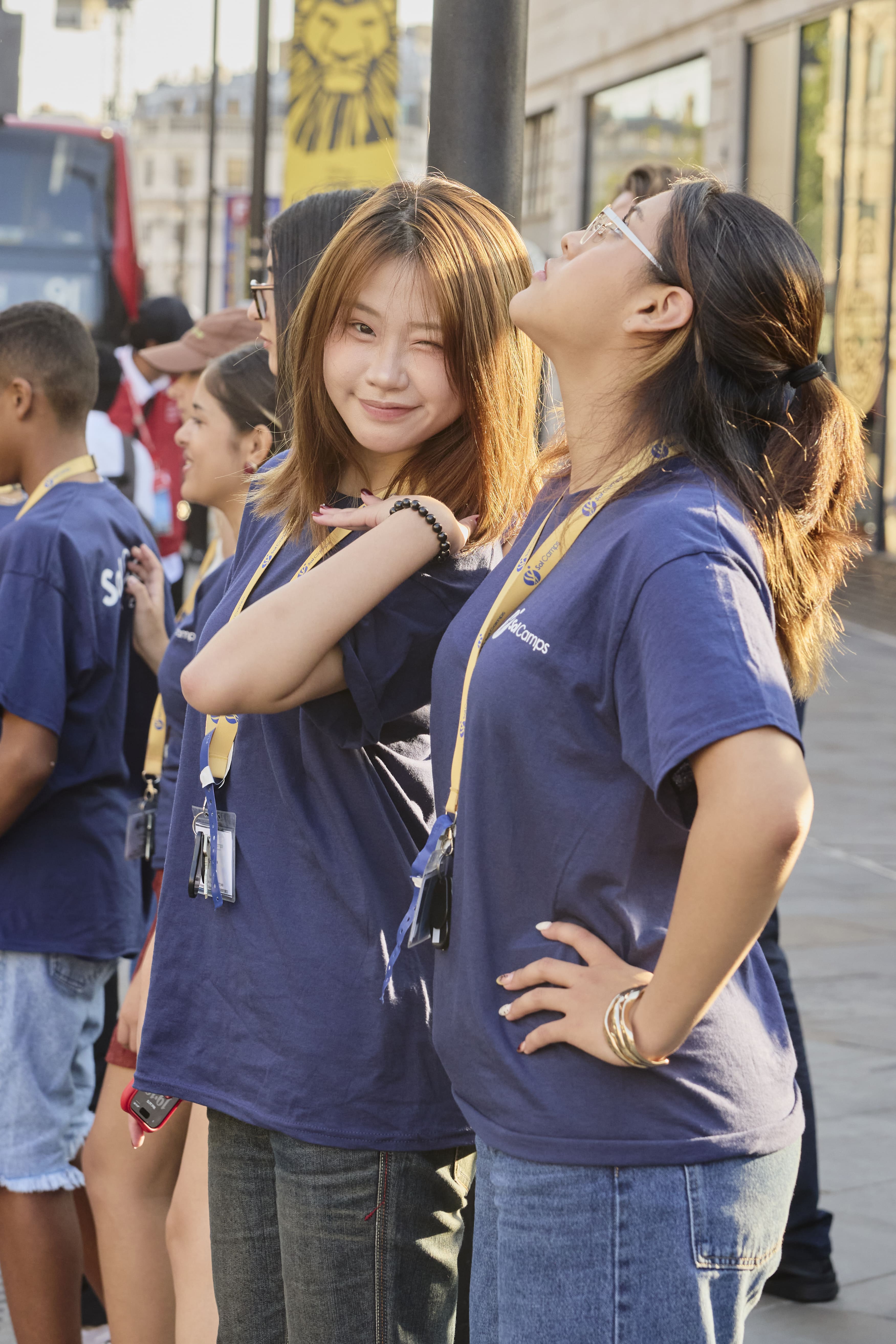 Sol Camps London campers in camp T-shirts and lanyards on a central London street during a city outing