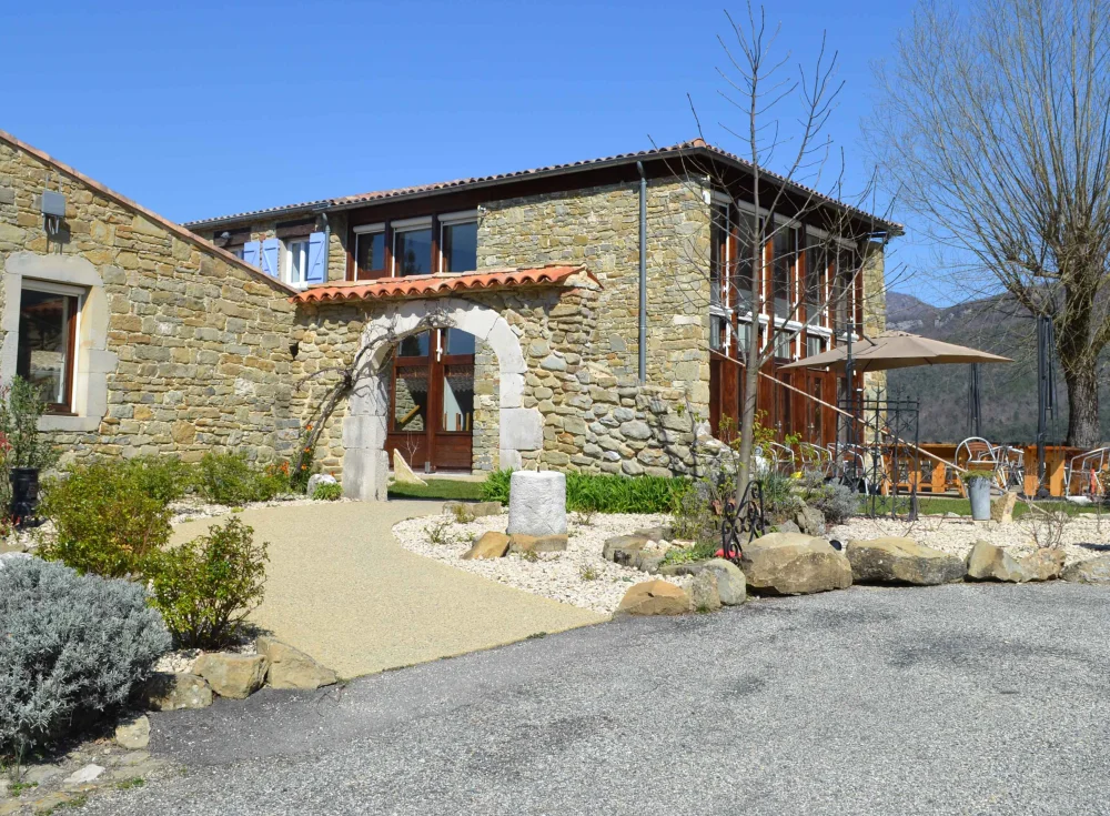 The main stone building of the Domaine with its arched entrance