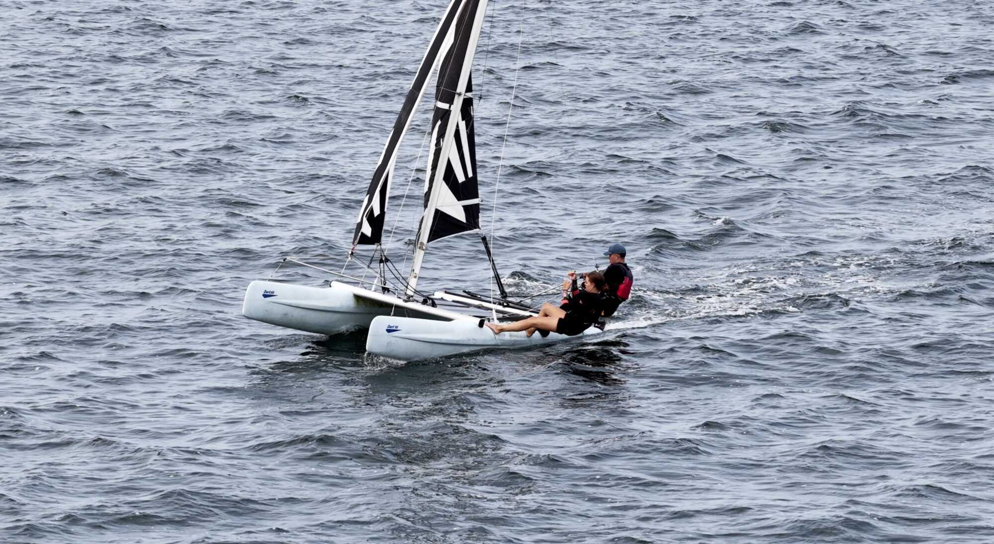 A catamaran under sail off Cuan Eilí during a Coláiste UISCE sailing session.