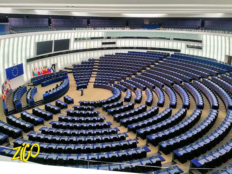Participants seated in the visitors gallery above the semicircular debating chamber of the European Parliament