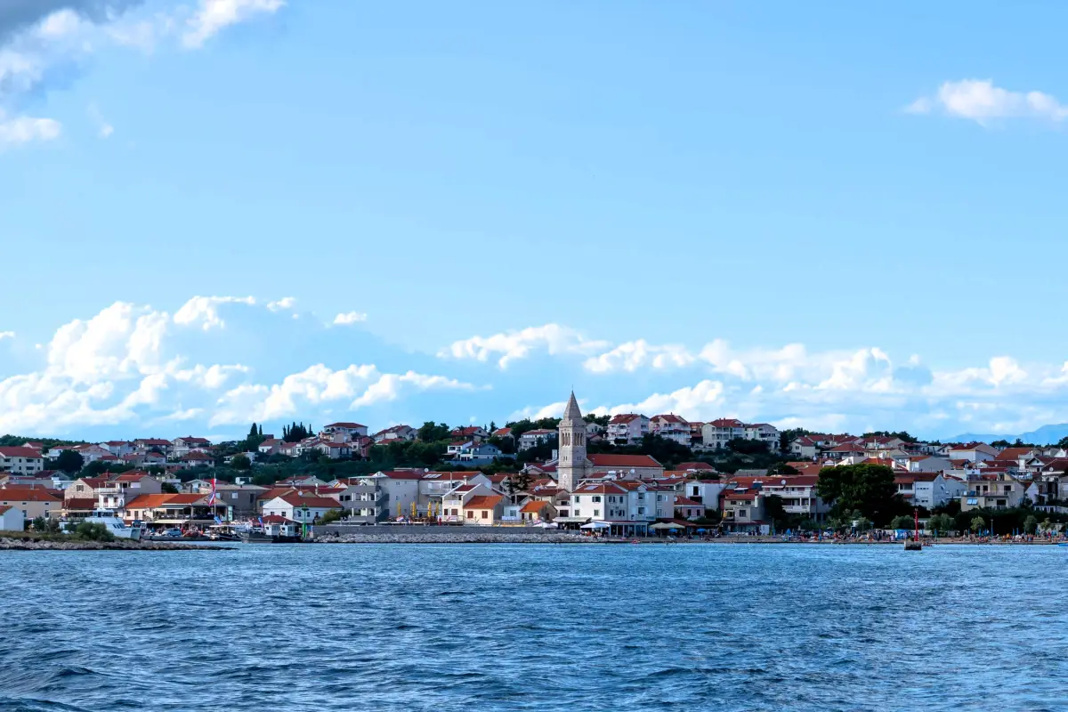 View across the bay to Pakostane with the church tower on the waterfront
