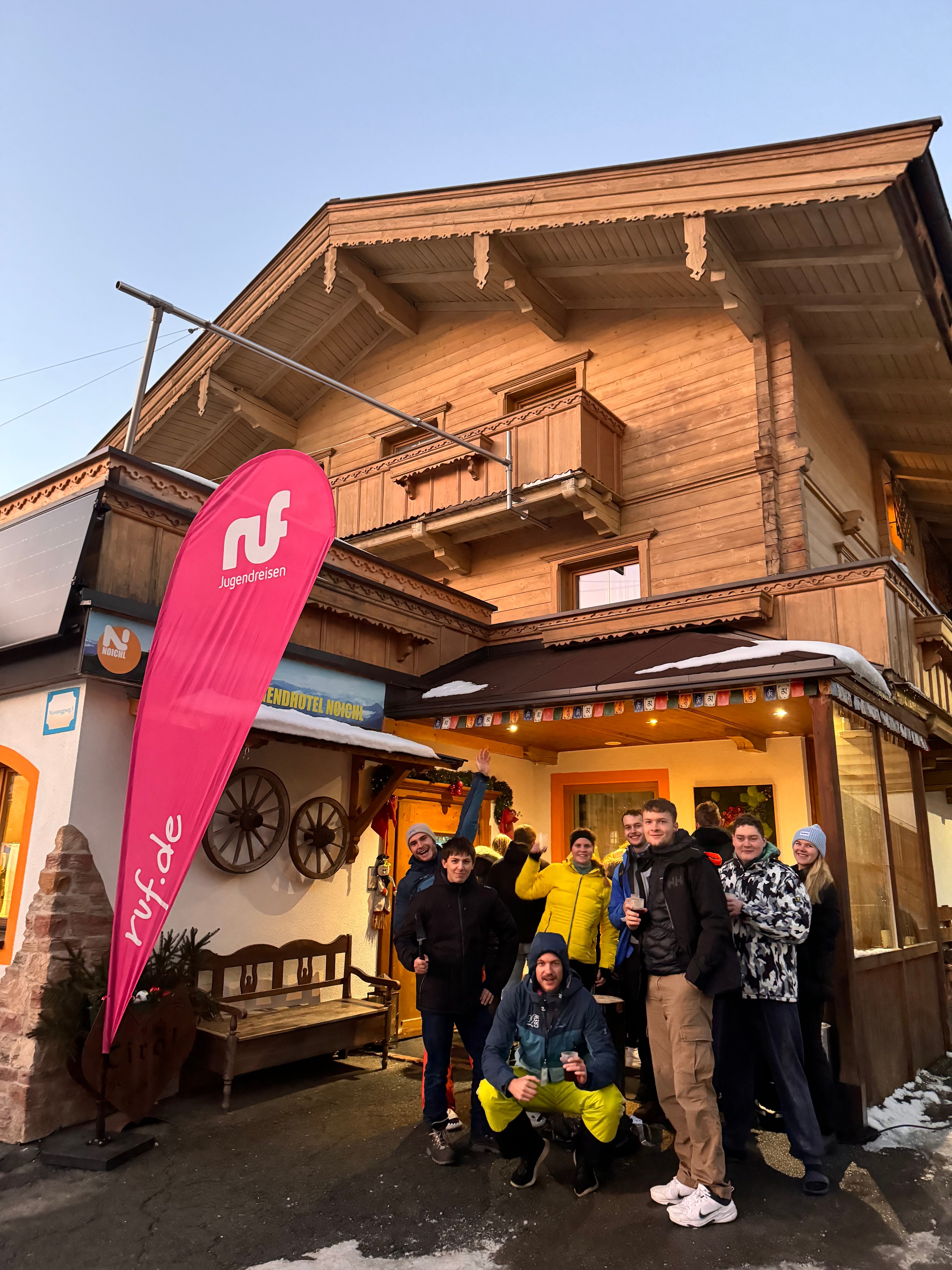 The camp group in front of the Jugendhotel with the operator banner
