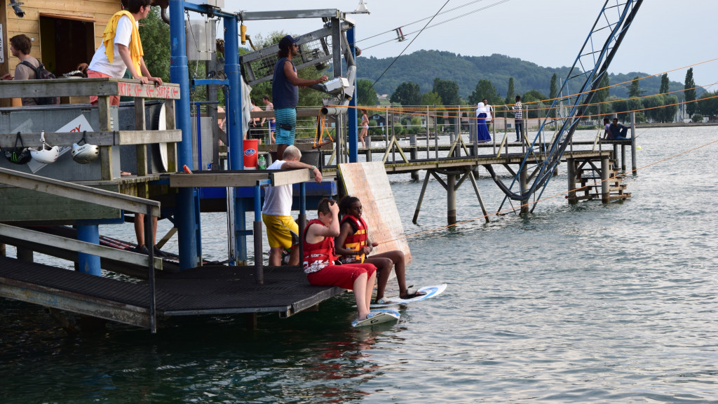 Wooden jetty on Lake Neuchatel beside the friLingue beach camp at Estavayer-le-Lac