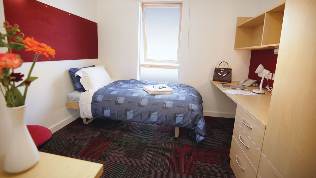 Single study bedroom with desk and wardrobe in the University of Sussex student accommodation used by the camp