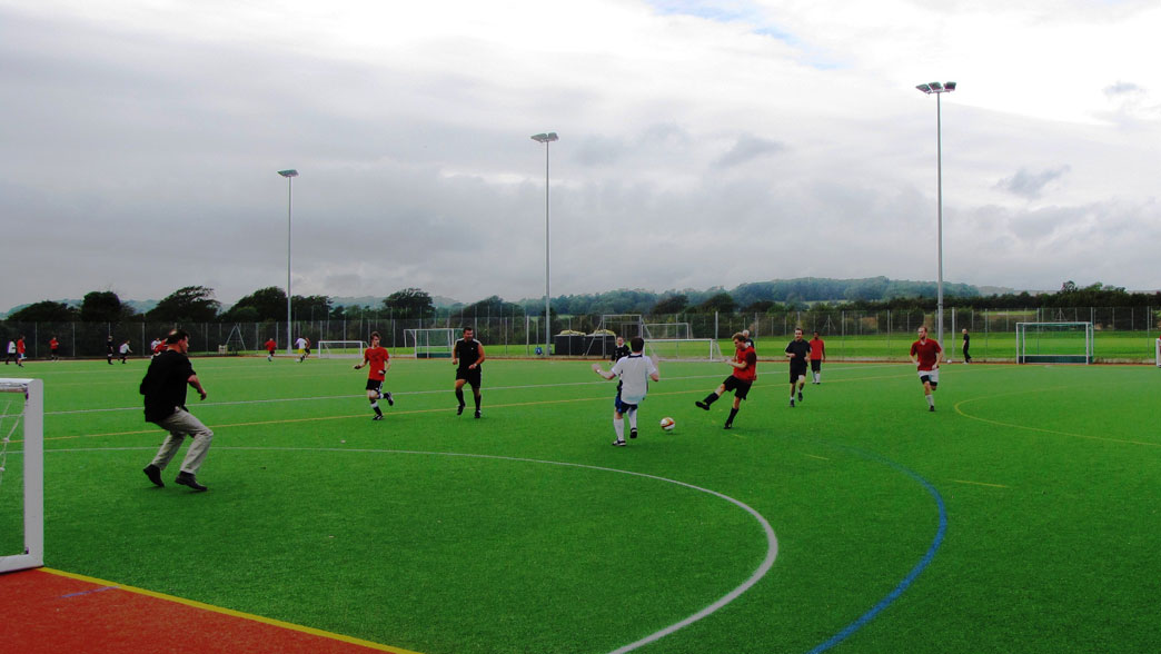 Evening football on the floodlit all-weather pitch on the University of Sussex campus