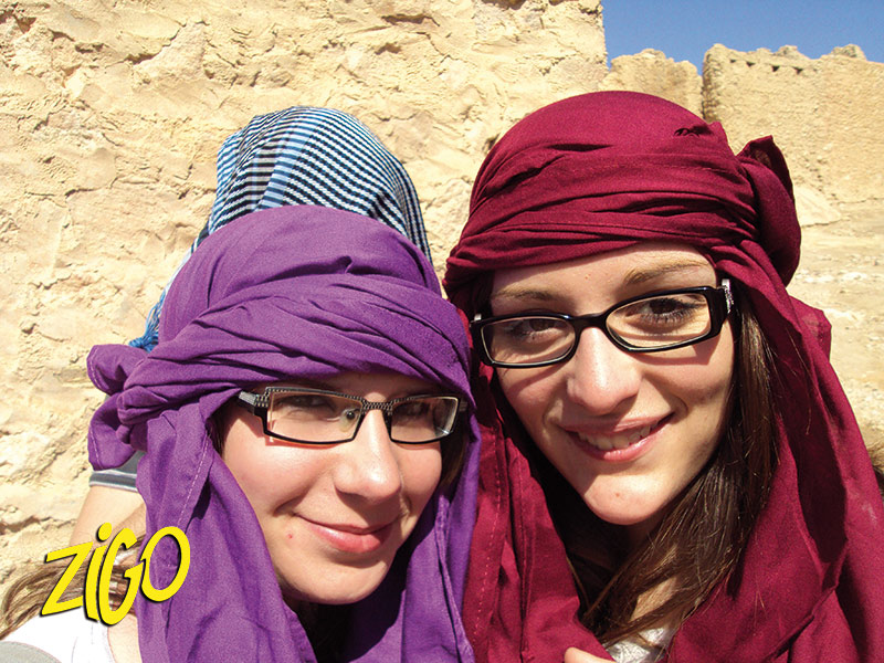 Two participants wearing desert headscarves