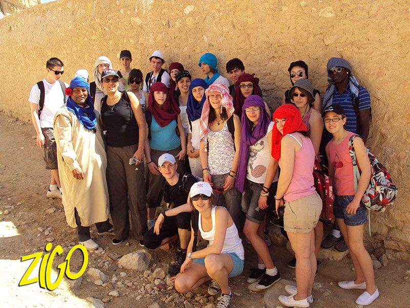 The group with its guide beside a rock wall in the south