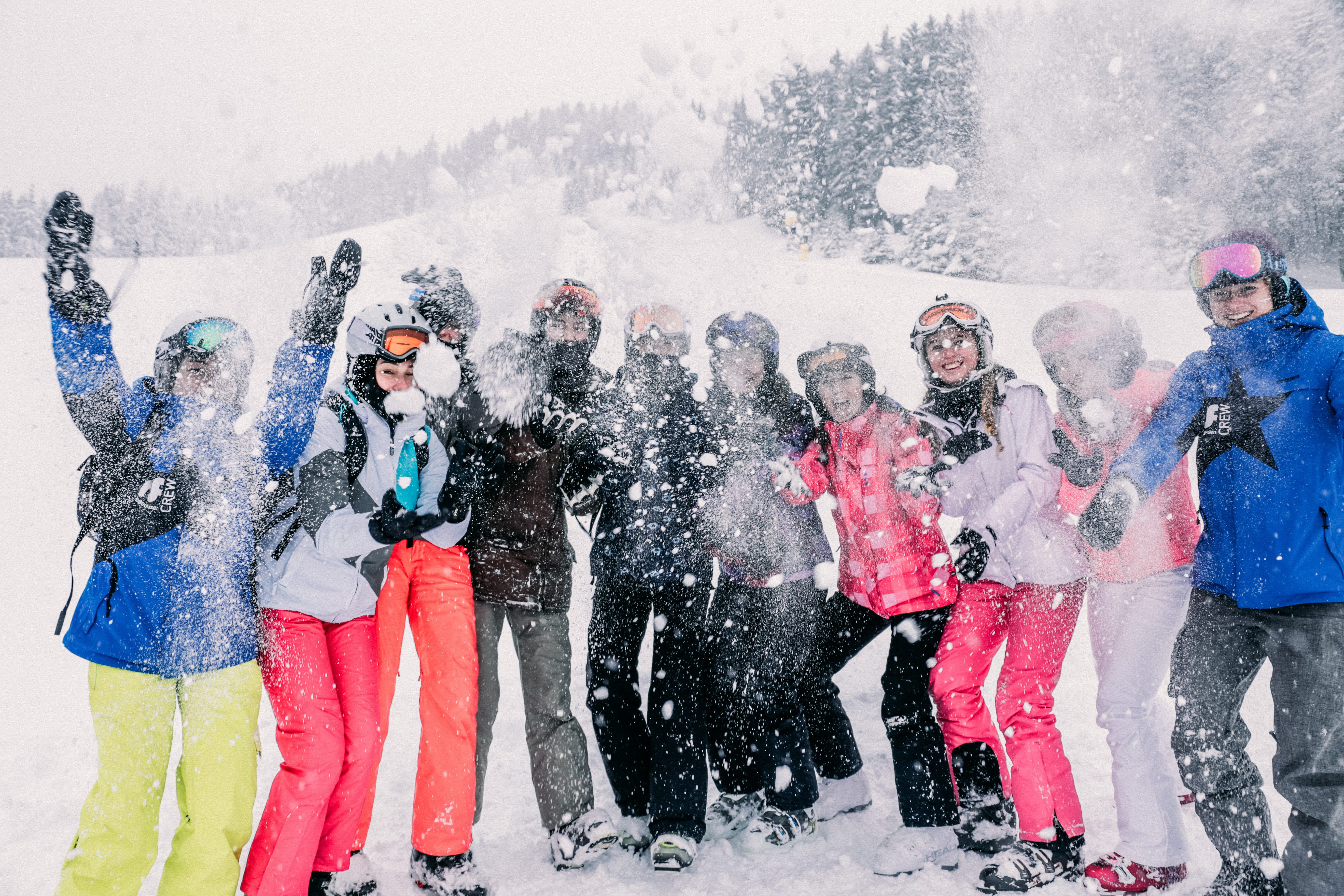Group photo of guests in a snowball fight