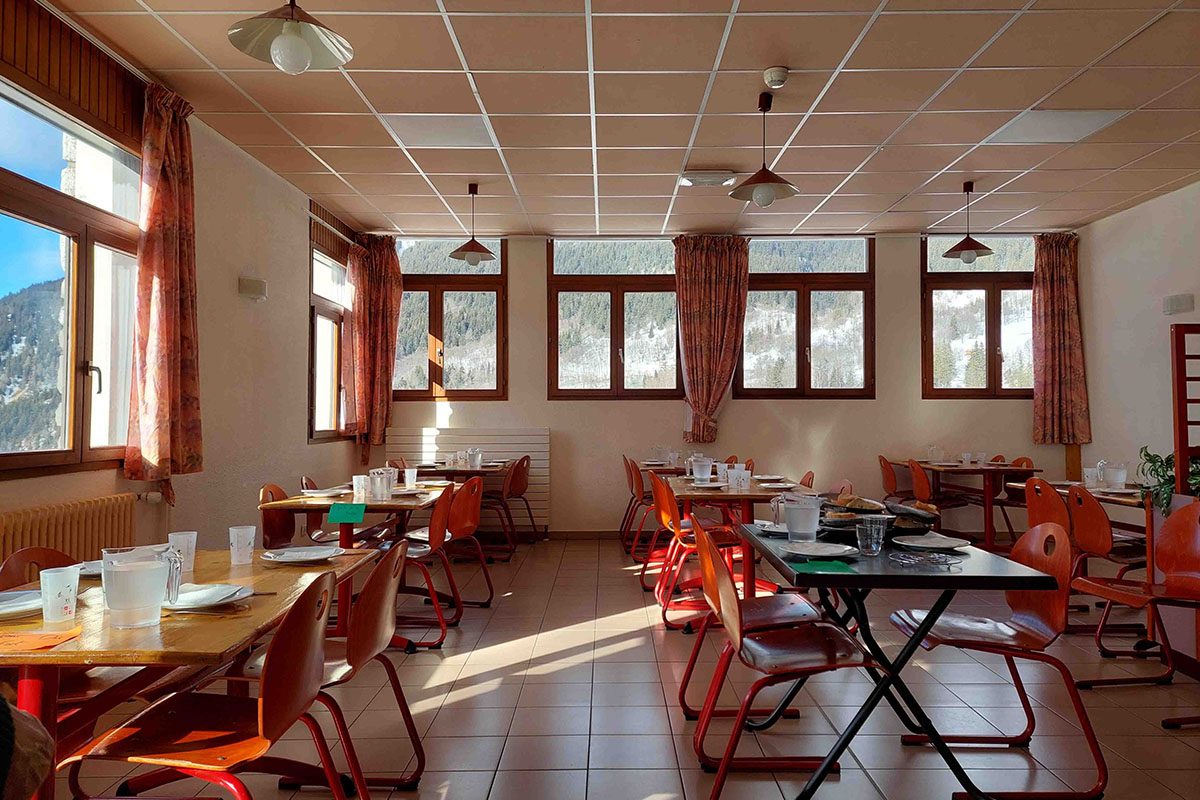 The dining room of the centre, with a panoramic mountain view
