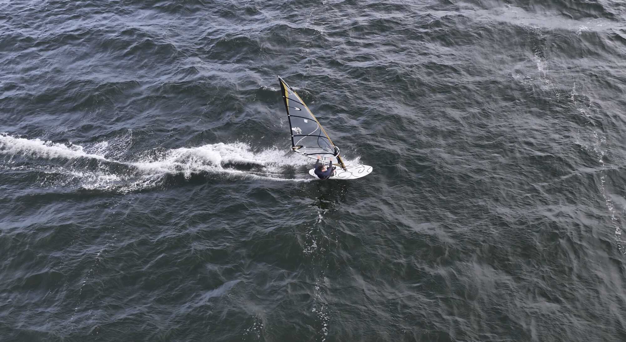 Aerial view of a student windsurfing on open water off the Mullet peninsula.