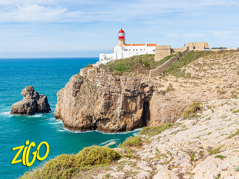 Lighthouse and fortified buildings on a high cliff above the Atlantic near Sagres