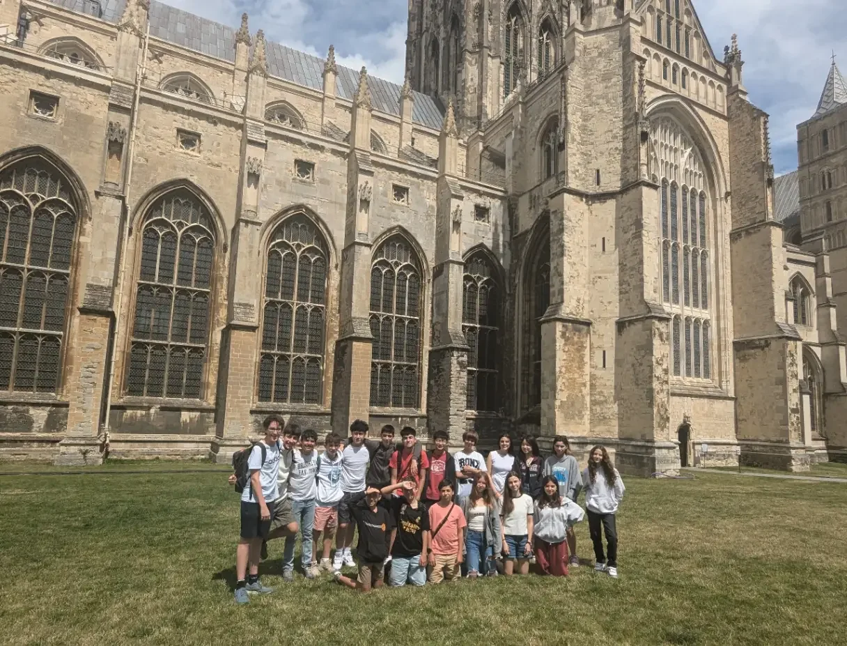 Claremont Summer School group on the lawn in front of Canterbury Cathedral
