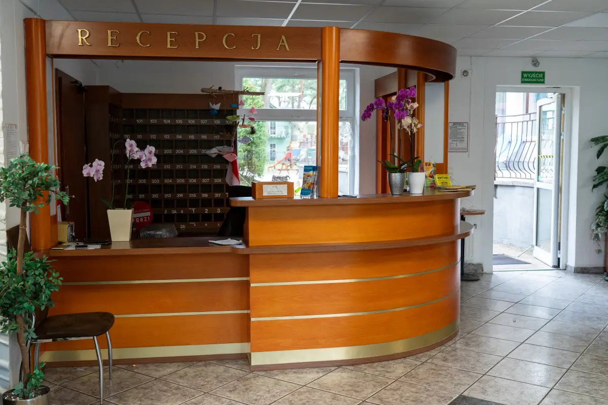 The wooden reception desk with key pigeonholes inside the holiday complex