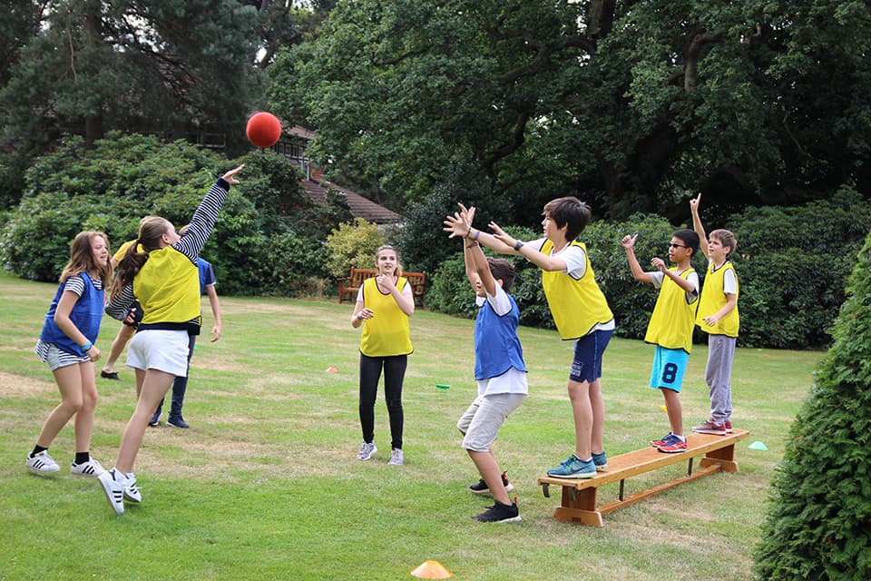 Students playing benchball in the sports hall at Marymount