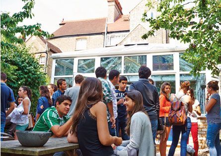 Garden with a conservatory at the LSI Cambridge school building