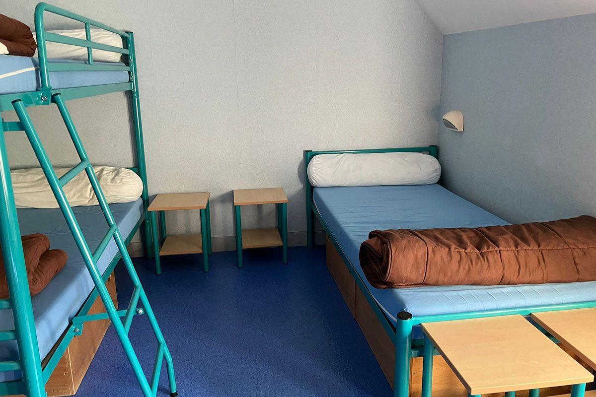 A bedroom at the Temps Jeunes centre in Thésée, where rooms hold between two and nine beds